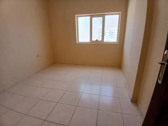 For annual rent, two rooms, a hall, two bathrooms, and a balcony in Al Rashidiya 3, Ajman : Image 1