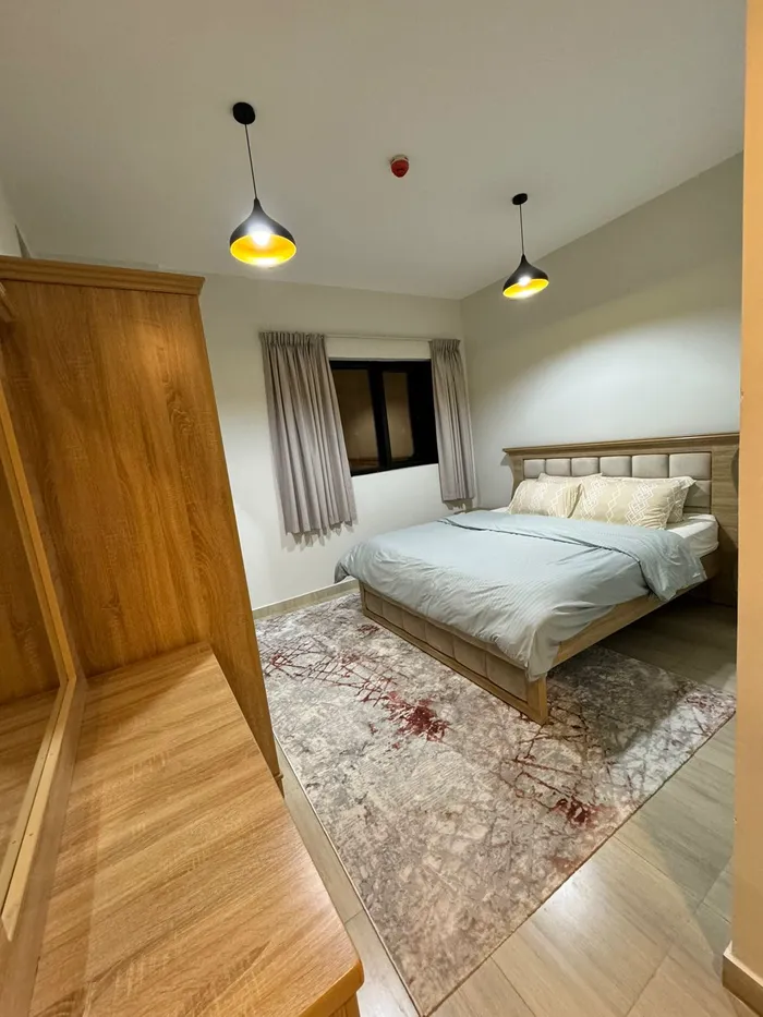 The Taawun room and hall is furnished for monthly rent with a balcony, a balcony, a gym and a swimming pool to book immediately : Image 1