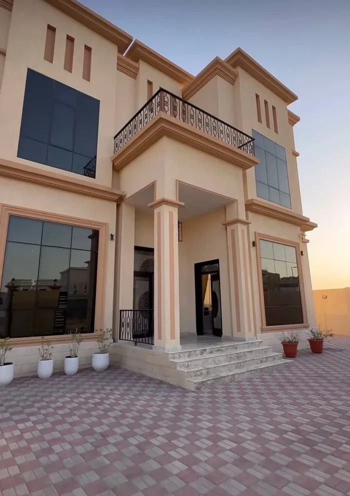 A new villa for sale in Sharjah, Al Hoshi area, consists of 5 master bedrooms, a hall, a majlis and a kitchen. There is an external extension with a kitchen, a maid's room, a laundry room, a pantry and an ironing room : Image 1