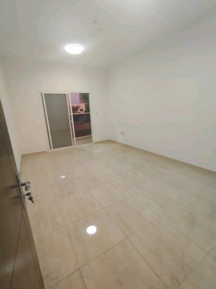 A room and a hall for annual rent in Ramila Ajman at a very special price : Image 1