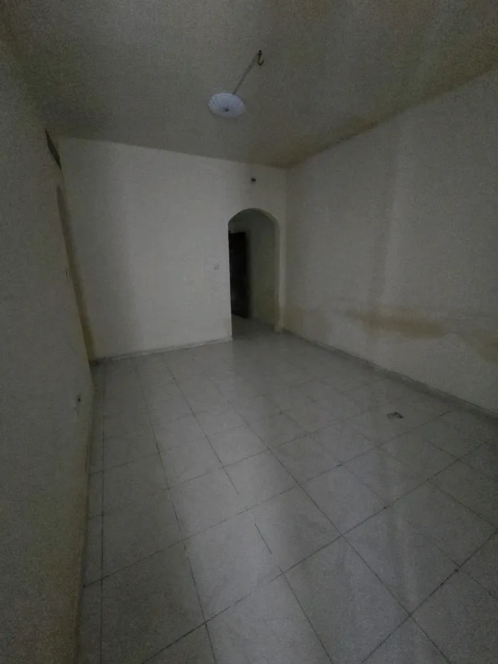 For annual rent, a one-bedroom apartment with a balcony, spacious areas, 2 bathrooms, in Ajman Industrial, close to Gift Way, close to Al Ittihad Street : Image 1