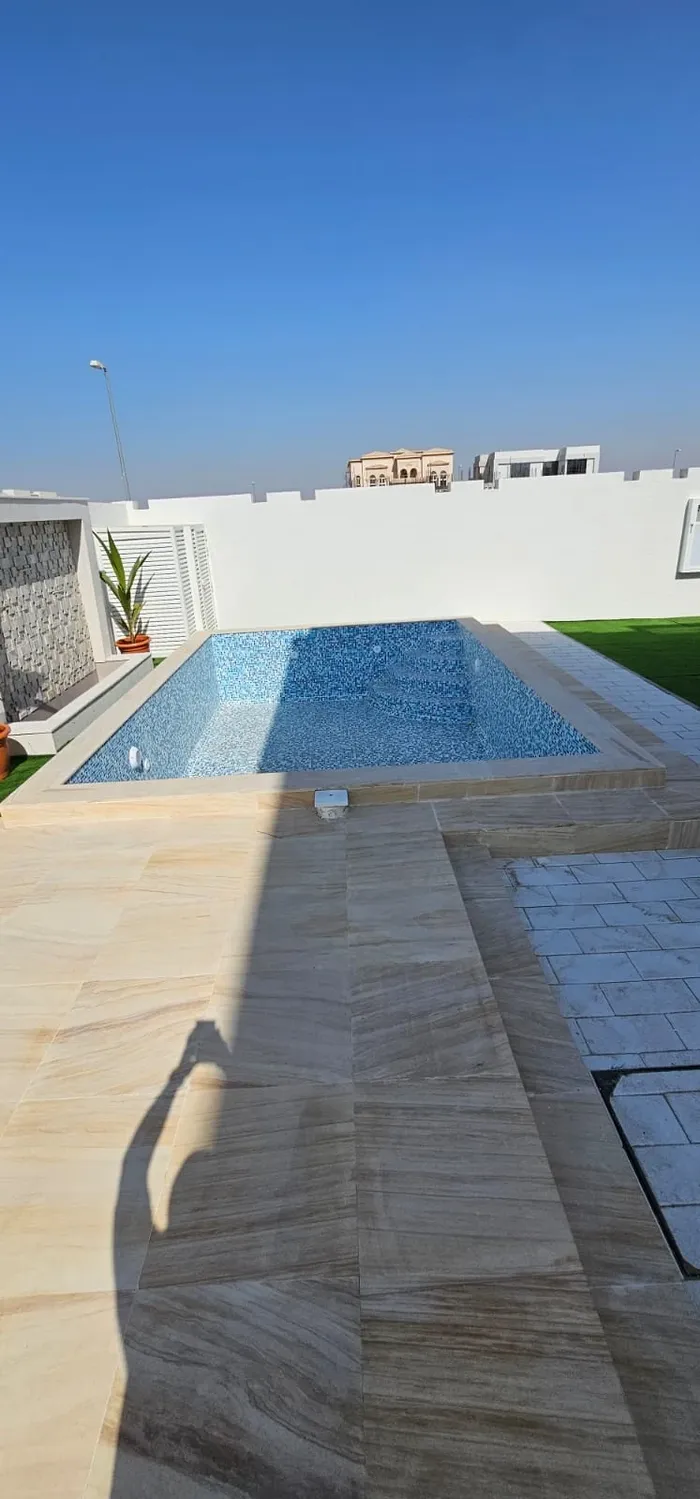 For sale a new villa covered with stone in Sharjah located in Al-Hoshi area. Two floors consist of: 5 master bedrooms+wall cabinets+two halls+majlis+preparatory kitchen : Image 1