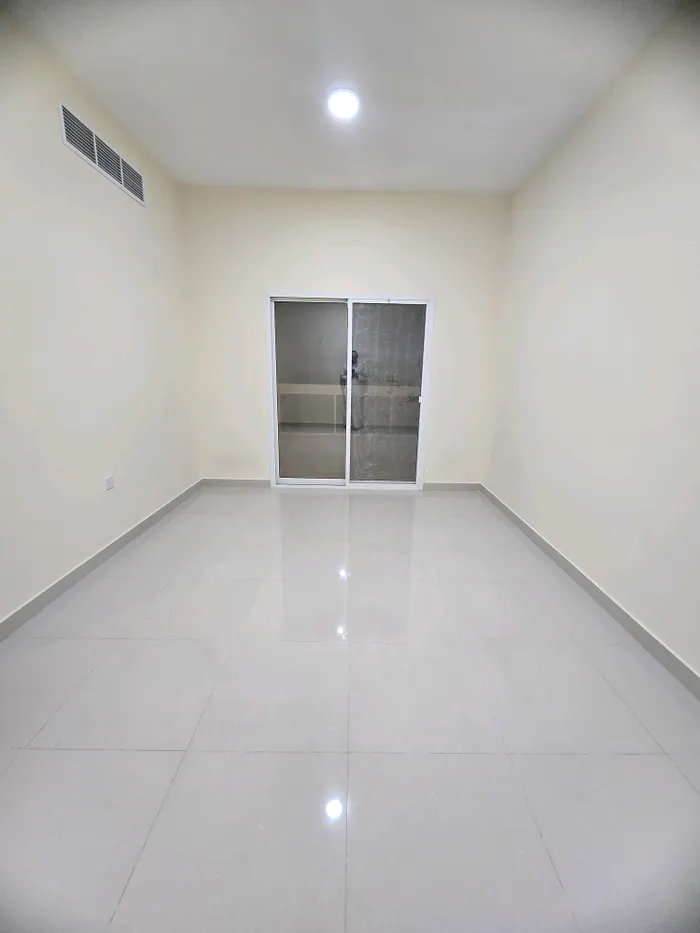 For rent a two-room apartment and a hall with a balcony, 2 bathrooms in Ajman, Al Mowaihat area 2, close to Sheikh Ammar Street : Image 1