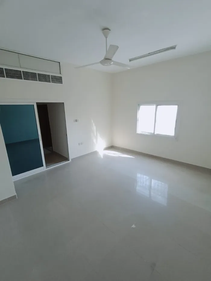 Two rooms and a hall for annual rent in Al Nuaimia Ajman, 2 bathrooms, a separate hall close to College Street : Image 1