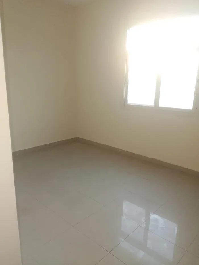 A room and a kitchen hall with a balcony for annual rent next to Al-Hekma School and Emirates Markets : Image 1