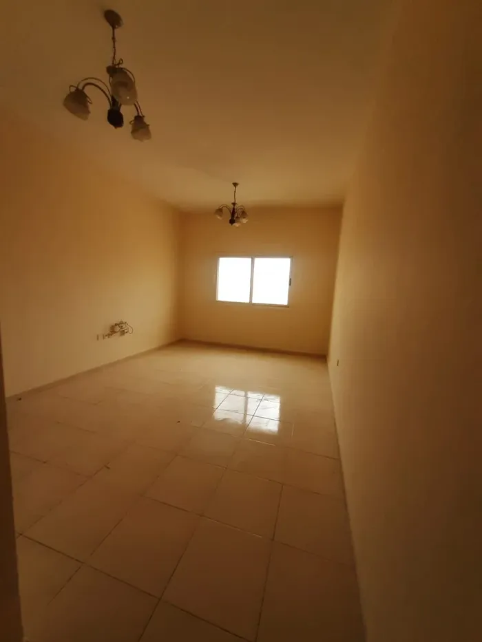 A room and a hall for annual rent in Al Nuaimia, Ajman, with a large area of free parking, close to the exit of Dubai and Sharjah : Image 1