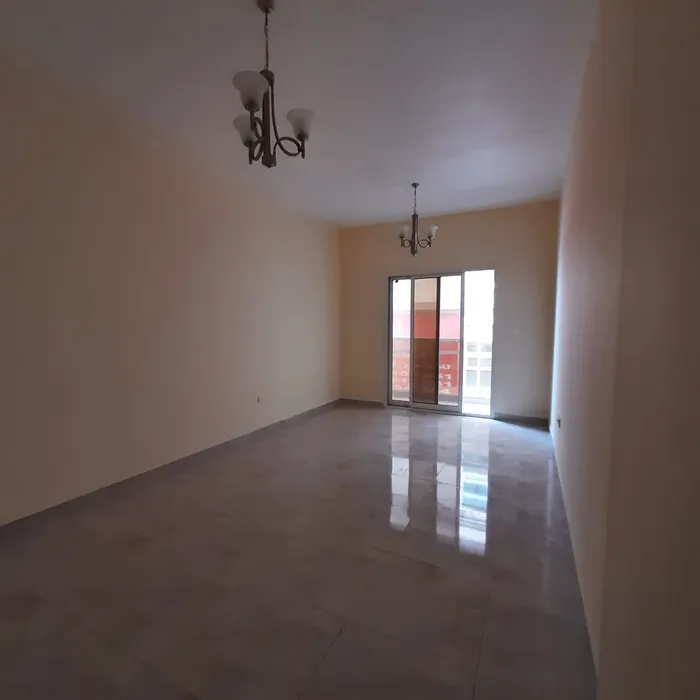 One bedroom apartment, kitchen hall with balcony, and central air conditioning in Ajman. Address: Al Jurf is close to Mohammed bin Zayed, directly from the exit of Dubai and Sharjah. //A 1-bedroom apartment with a living room, a kitchen, a balcony, a : Image 1