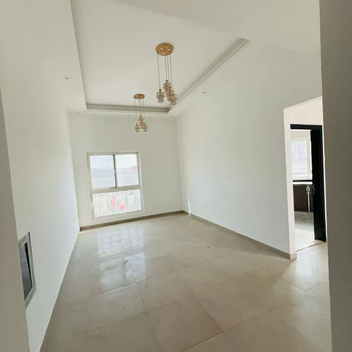 A special opportunity, a room, a hall, 2 bathrooms, a spacious area with a balcony, the address is in Al Rashidiya 1 - Ajman, close to the Mohammed bin Zayed exit : Image 1