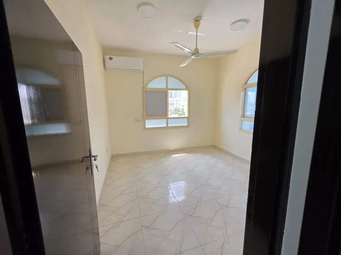 For annual rent, a two-bedroom apartment with a hall next to the Grand Mall, close to Sharjah and Dubai : Image 1