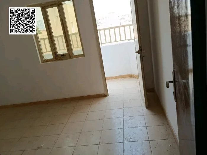 Apartment for annual rent in Ajman, Al Rawdah, 3 rooms, hall, kitchen, 2 bathrooms, balcony and ground parking : Image 1