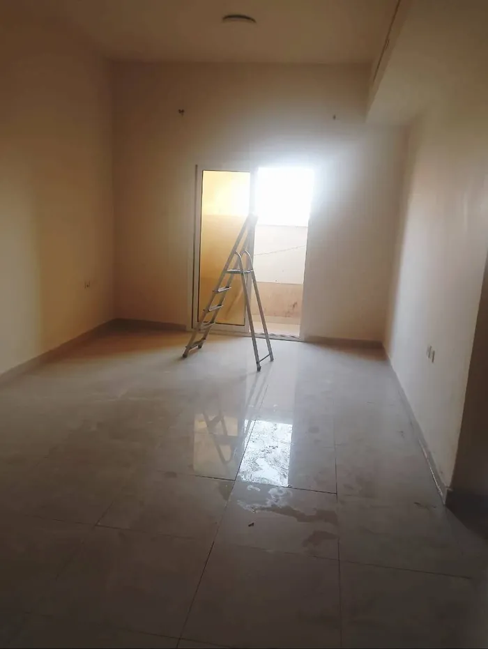 For annual rent in Al Rawdah 2, Ajman, a room and a balcony on Ammar Main Street/For annual rent in Al Rawda 2, Ajman One bedroom and a living room with a balcony on Ammar Main Street : Image 1