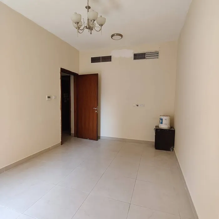 Two rooms and a large hall with a balcony and two bathrooms in Rashidiya 3 Ajman : Image 1