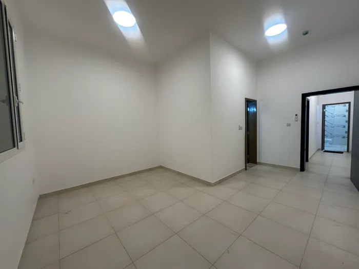 A three-room apartment, a hall and a maid's room with five bathrooms for rent in Bani Yas city, a great location close to services, a very spacious area : Image 1
