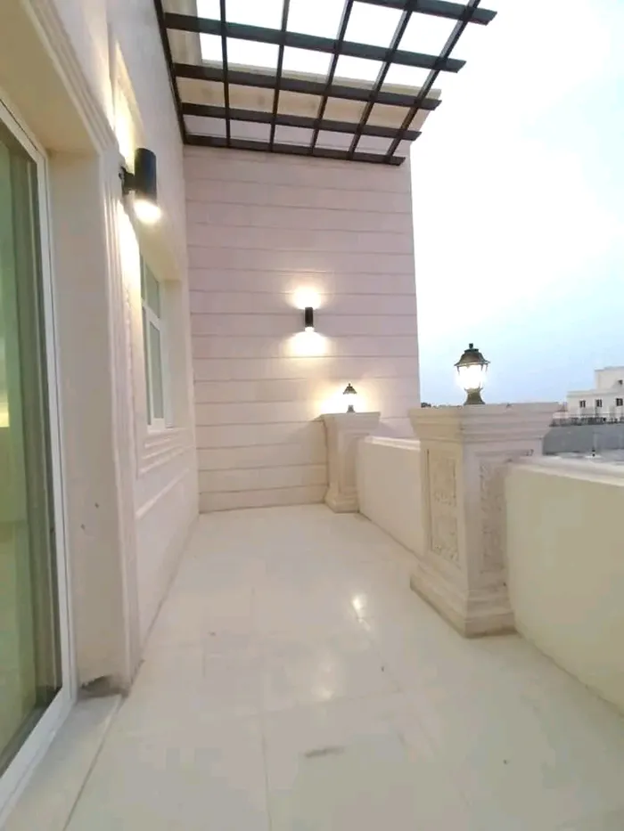 A room and a hall with a balcony for rent in Shakhbout City : Image 1