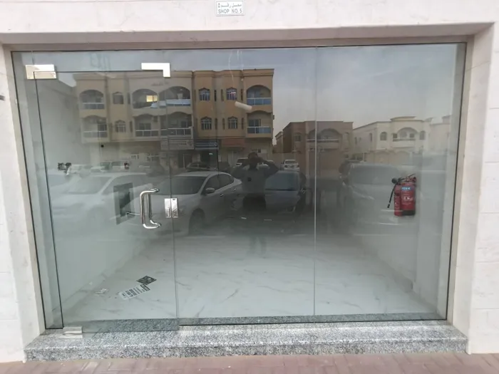A commercial shop for annual rent in Al Rawdha 3, Ajman, strategically located near Abu Dhabi Commercial Bank, suitable for various activities with an area of 339 feet and only 4 installments : Image 1