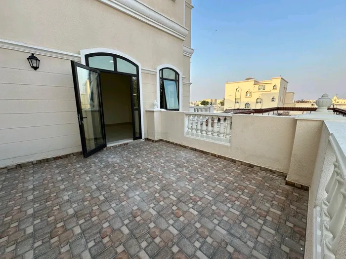 For annual rent: a two-bedroom apartment with a living room, balcony, and maid's room in Bani Yas, Abu Dhabi : Image 1
