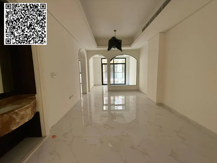 For annual rent in Ajman, a new building is available. The first resident is available. A two-room apartment, a hall, a majlis with 2 bathrooms, a balcony with an open view, a spacious area, central air conditioning, wall cabinets with a free month,  : Image 1