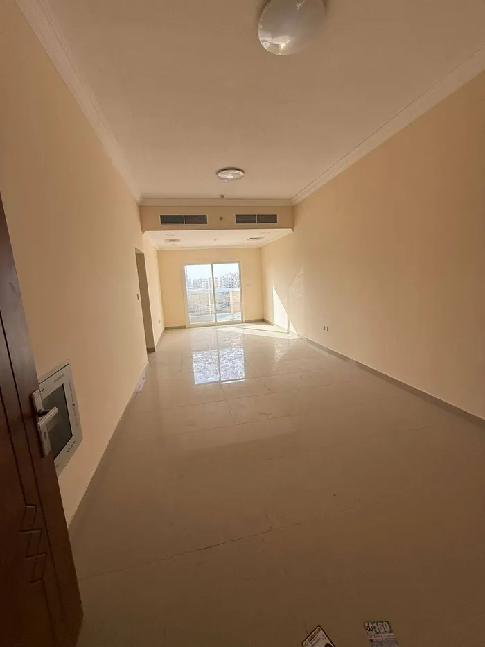Two rooms and a hall for the first resident of Al Jerf 3 new tower for annual rent in Ajman with wall cabinets and a store : Image 1